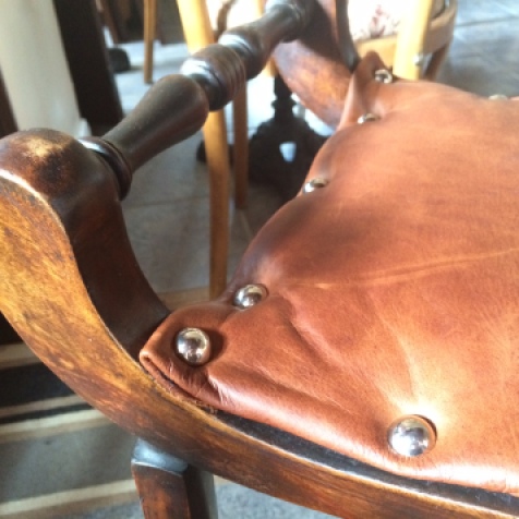 georgian stool close up; thick studded leather